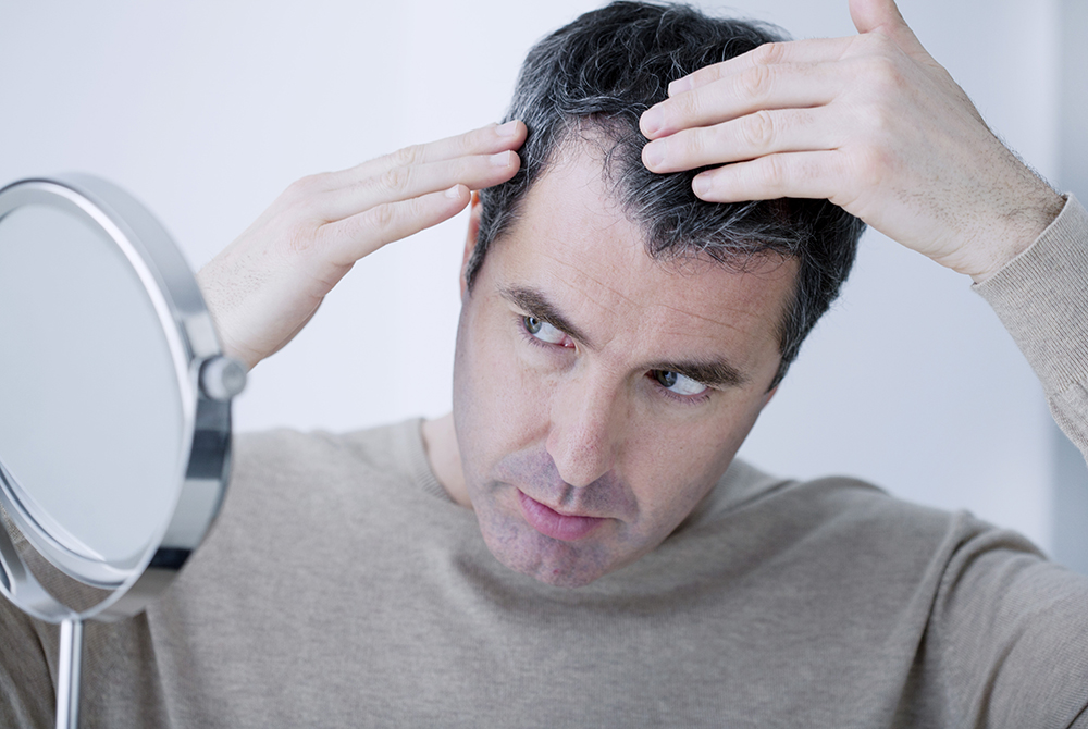 Man,With,Mirror Scottsdale Skin Boutique & Dermatology