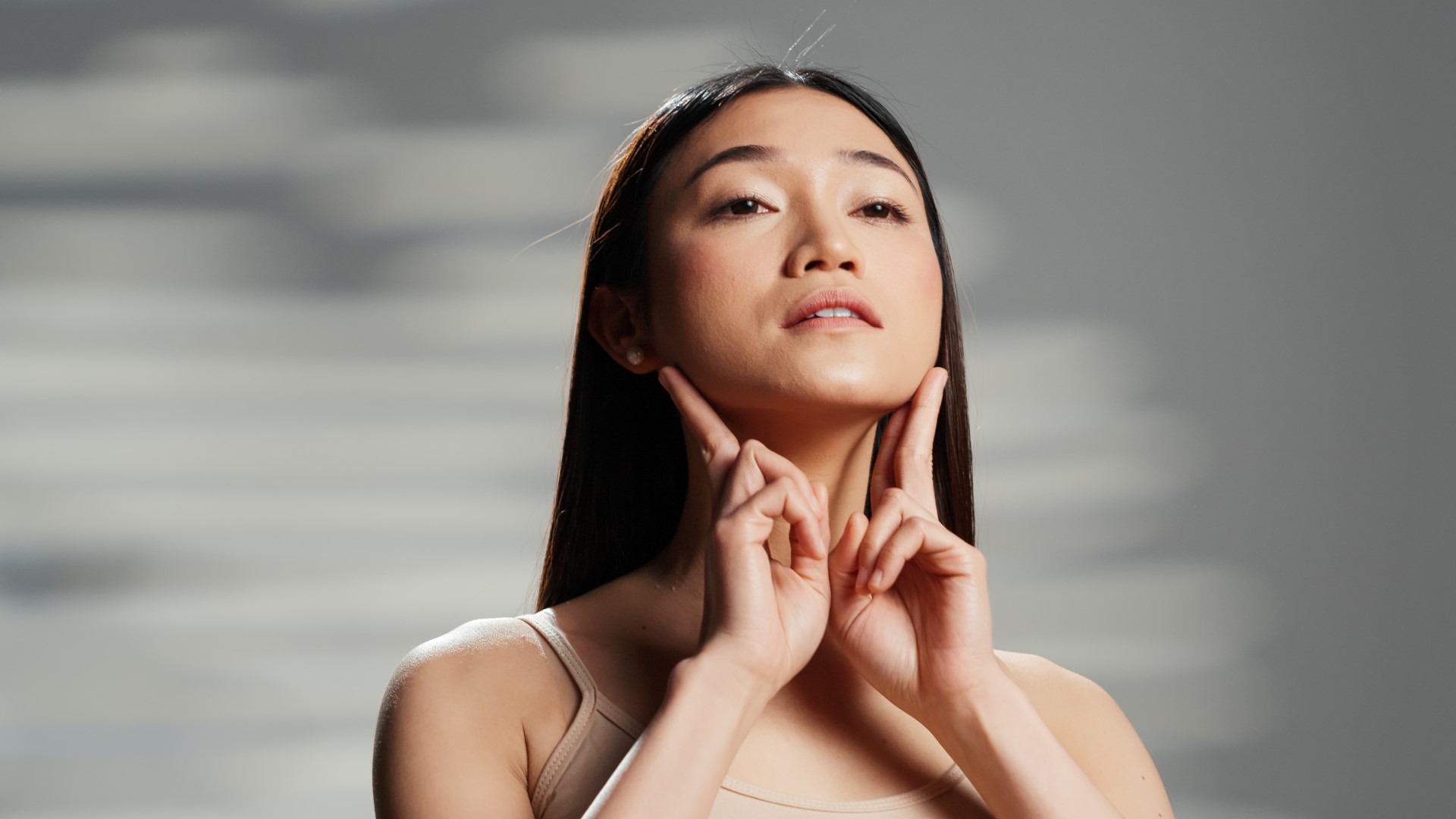 woman showing off her lack of double chin after kybella injections